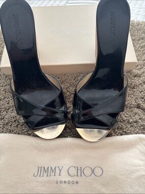 Jimmy Choo Black Patent Crisscross Slide Mules with Gold Toe Plate